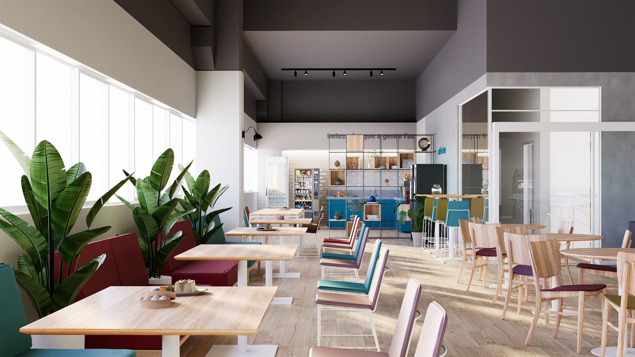 Espaço de descompressão corporativo com copa integrada, plantas naturais, mobiliário colorido e ambiente iluminado por luz natural.