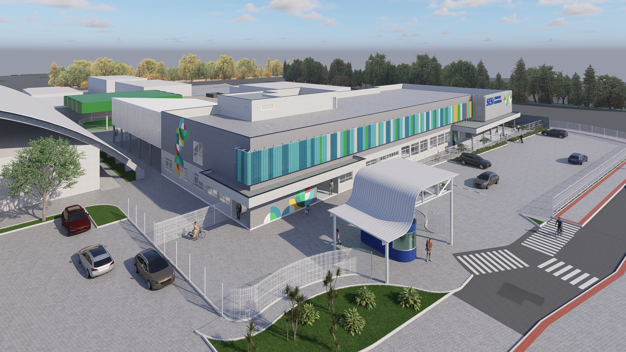 Vista aérea da Escola SESI com volumetria modular e fachadas em painéis metálicos coloridos