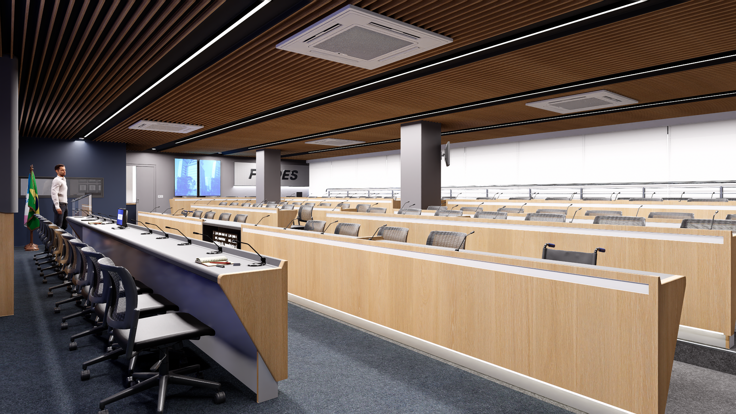 Mesa principal de plenário com monitores e microfones, bancadas em marcenaria e forro ripado com iluminação linear