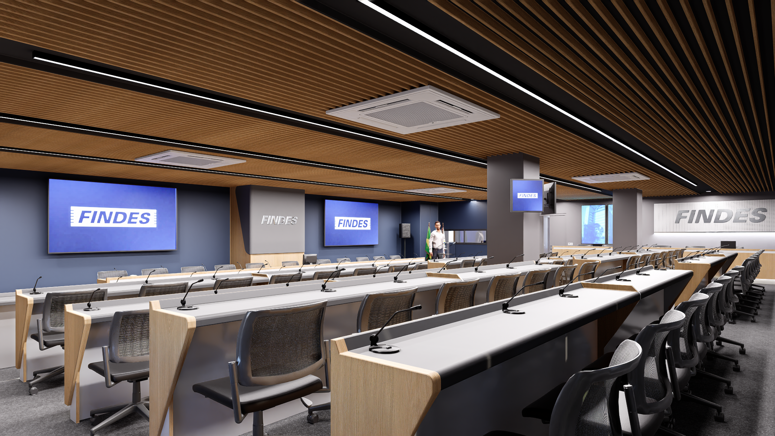 Plenário corporativo com layout em auditório, bancadas com microfones, painéis institucionais e forro ripado com iluminação linear